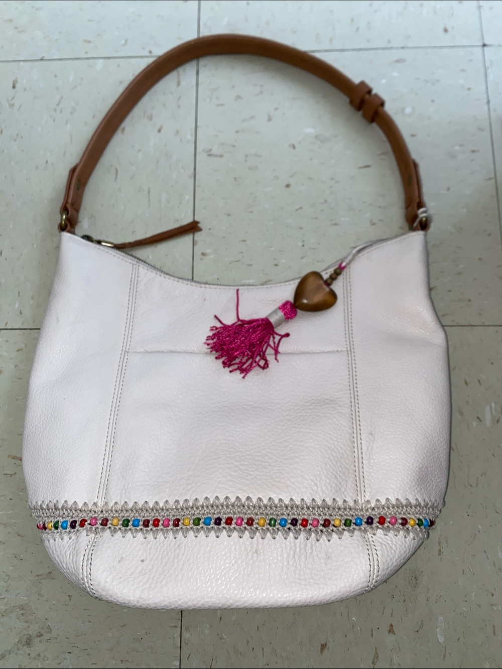 The Sak sequoia hobo Leather Shoulder Bag with Tan Strap and Pink Tassel